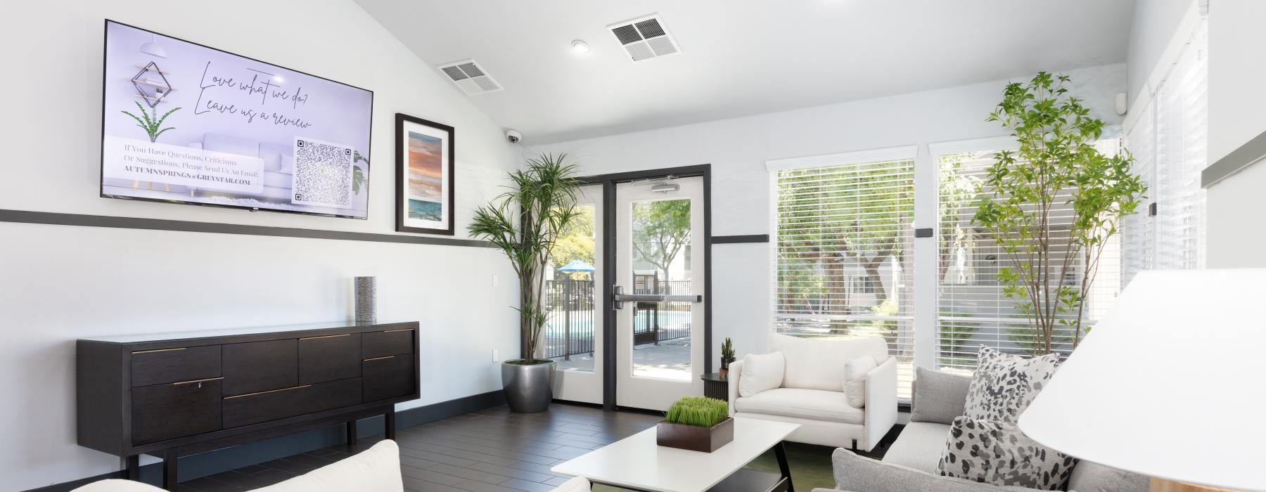 a spacious room with white furniture